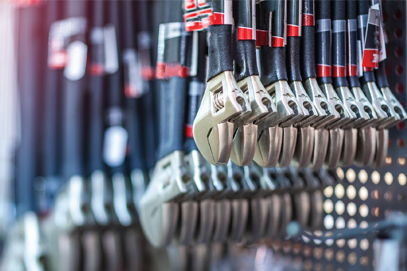 Close up photo of wrenches on a rack in a retail store